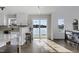 Bright kitchen features a breakfast bar and sliding glass doors showcasing stunning waterfront views at 512 N Waters Edge Dr, Durham, NC 27703