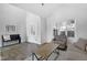 Bright living room featuring wood floors, neutral decor, vaulted ceilings, and ample natural light at 512 N Waters Edge Dr, Durham, NC 27703