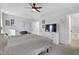 Bright main bedroom boasts a tray ceiling, dresser, and ensuite bathroom at 512 N Waters Edge Dr, Durham, NC 27703