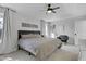 Comfortable main bedroom showcasing neutral tones, ample natural light, and cozy seating at 512 N Waters Edge Dr, Durham, NC 27703