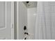Bright bathroom shower with a white shower curtain and updated fixtures that create a clean and inviting space at 512 N Waters Edge Dr, Durham, NC 27703