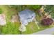 Aerial view of a home showing a metal roof, landscaping, and surrounding yard at 516 W Fourth St, Siler City, NC 27344