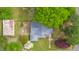 Bird's-eye view of a house with a metal roof, set in a lush, green landscape at 516 W Fourth St, Siler City, NC 27344