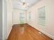 Sunlit bedroom featuring hardwood floors, fan, and neutral colored walls offers a calming space at 516 W Fourth St, Siler City, NC 27344