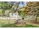 Landscaped front yard featuring mature trees framing the home at 516 W Fourth St, Siler City, NC 27344