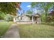 Charming home with a welcoming front porch and mature trees offering shade at 516 W Fourth St, Siler City, NC 27344