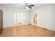 Open living room with hardwood floors and classic glass paneled doors to other rooms at 516 W Fourth St, Siler City, NC 27344