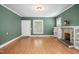 Living room with hardwood floors, neutral wall color, and views to other rooms at 516 W Fourth St, Siler City, NC 27344