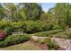 Lush backyard featuring a chicken coop with garden at 521 Wildwood Farm Way, Holly Springs, NC 27540