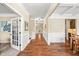 Elegant entryway with hardwood floors, wainscoting, and decorative accents create a welcoming atmosphere at 521 Wildwood Farm Way, Holly Springs, NC 27540