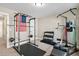 Home gym featuring weightlifting equipment, free weights, and exercise mats at 521 Wildwood Farm Way, Holly Springs, NC 27540
