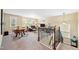 Open-concept living room with stairs, a sitting area and a television at 521 Wildwood Farm Way, Holly Springs, NC 27540