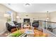 Upstairs lounge with a sitting area, TV, and a game table at 521 Wildwood Farm Way, Holly Springs, NC 27540