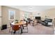 Upstairs area featuring a sitting area, television, and round table at 521 Wildwood Farm Way, Holly Springs, NC 27540