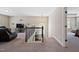 Open loft featuring a comfortable seating area, media center, and a staircase with decorative wrought iron railings at 521 Wildwood Farm Way, Holly Springs, NC 27540