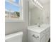 Bathroom with a white vanity, ample lighting and view of the neighborhood at 5505 Armada Dr, Raleigh, NC 27610