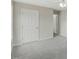 Cozy bedroom offers soft carpeting and ample closet space at 5505 Armada Dr, Raleigh, NC 27610