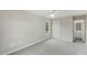 Spacious bedroom with neutral paint, comfortable carpeting, and a bright window at 5505 Armada Dr, Raleigh, NC 27610
