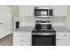Kitchen featuring granite countertops and stainless steel oven and microwave at 5505 Armada Dr, Raleigh, NC 27610