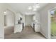 Well-lit kitchen with stainless steel appliances, white cabinets, and granite countertops at 5505 Armada Dr, Raleigh, NC 27610