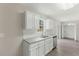 Bright kitchen featuring stainless steel appliances and white cabinets at 5505 Armada Dr, Raleigh, NC 27610