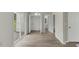 View from living room featuring a sliding glass door with connecting doors to laundry and bathroom at 5505 Armada Dr, Raleigh, NC 27610