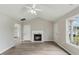 Inviting living area features a cozy fireplace and durable modern flooring at 5505 Armada Dr, Raleigh, NC 27610