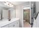 Bathroom features a shower and a single vanity with good lighting at 572 W Walker Woods Ln, Clayton, NC 27527