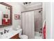 Well-maintained bathroom with shower-tub combo and decorative mirror at 572 W Walker Woods Ln, Clayton, NC 27527