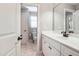 This bright bathroom has a double vanity and a separate toilet room at 572 W Walker Woods Ln, Clayton, NC 27527
