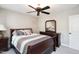 This bedroom is furnished with a full bed and has a ceiling fan at 572 W Walker Woods Ln, Clayton, NC 27527