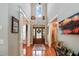 Grand foyer featuring high ceilings, hardwood floors, and a beautiful wood front door with glass panels at 572 W Walker Woods Ln, Clayton, NC 27527