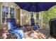 Inviting outdoor deck with comfortable lounge chairs and a charming umbrella for shaded relaxation at 572 W Walker Woods Ln, Clayton, NC 27527