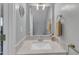 Updated bathroom with new fixtures, neutral color palette, and modern mirror at 5900 Shady Grove Cir, Raleigh, NC 27609