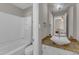 Bright bathroom with white bathtub, granite vanity, and vessel sink at 5900 Shady Grove Cir, Raleigh, NC 27609