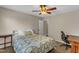 Bedroom with a bed, side table, ceiling fan, desk, and chair at 5900 Shady Grove Cir, Raleigh, NC 27609