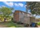 View of the exterior showing a mix of siding and brick with a fenced in patio area at 5900 Shady Grove Cir, Raleigh, NC 27609