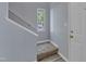 Light and airy foyer showcasing stairs, fresh paint, and a view to the outside at 5900 Shady Grove Cir, Raleigh, NC 27609