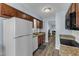 Spacious kitchen features modern appliances, granite countertops, and wood cabinets at 5900 Shady Grove Cir, Raleigh, NC 27609