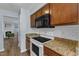 Well-equipped kitchen features modern appliances, granite countertops, and ample cabinet space at 5900 Shady Grove Cir, Raleigh, NC 27609