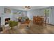 Inviting living room with a fireplace, ceiling fan, and a combination dining area at 5900 Shady Grove Cir, Raleigh, NC 27609