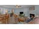 Open-concept living room with fireplace and modern decor at 5900 Shady Grove Cir, Raleigh, NC 27609