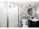 Modern bathroom with glass-enclosed shower and vanity, showcasing a contemporary design at 6238 Old 421 Rd, Liberty, NC 27298
