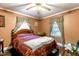 Comfortable bedroom with a ceiling fan and bright, natural light, creating an inviting space at 6238 Old 421 Rd, Liberty, NC 27298