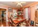 Formal dining room showcasing traditional furniture, elegant decor, and soft lighting at 6238 Old 421 Rd, Liberty, NC 27298