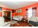 Inviting living room featuring bright walls, hardwood floors, and comfortable seating arrangements at 6238 Old 421 Rd, Liberty, NC 27298