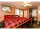 Spacious main bedroom featuring ample natural light, a ceiling fan, and a decorative accent wall at 6238 Old 421 Rd, Liberty, NC 27298