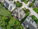Bird's eye view of a neighborhood home featuring mature trees, manicured lawns, and an outdoor living space at 629 Peach Orchard Pl, Cary, NC 27519
