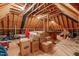 Spacious unfinished attic with exposed wooden beams, offering ample storage or conversion potential at 629 Peach Orchard Pl, Cary, NC 27519