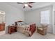 Bright bedroom with a window, bedside table, and a comfortable reading chair at 629 Peach Orchard Pl, Cary, NC 27519